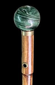 Cane with a round marbled wood knob.