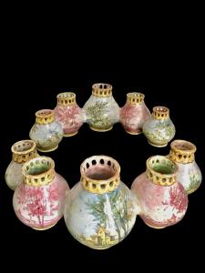 Centerpiece consisting of two series of globular vases decorated with landscapes. Minghetti Bologna manufacture.