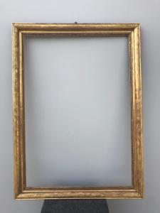 Wooden frame, carved and gold leaf with engraved vegetal motifs.