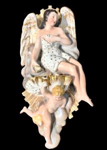 Porcelain holy water font depicting a seated angel with a putto. France.