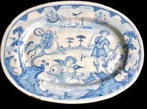 Large oval majolica dish in monochrome turquoise decorated with figures and architecture. Deruta manufacture.