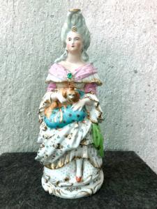 Porcelain veilleuse or night light teapot depicting a female figure with a dog. France, Louis-Philippe period.