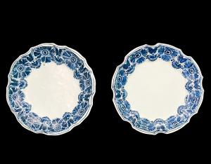 Pair of majolica plates in turquoise monochrome with stylized floral decoration. Ferniani Manufacture, Faenza.