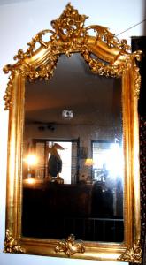 Imposing and decorative mirror from the mid-1800s, gold leaf. Central Europe, circa 1870.
