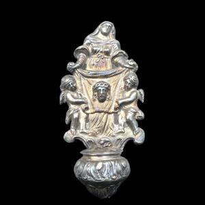 Embossed silver stoup depicting Saint Veronica displaying the cloth with the face of Christ. Hallmarked.