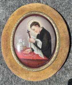 Gerahmte ovale Porzellanminiatur, die den heiligen Franziskus darstellt.