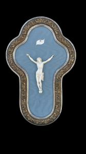 Ivory Christ with shaped and silvered wooden frame.