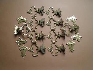 serie di maniglie antiche in bronzo dorato