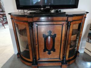 Three-door cabinet in thuja burl and ebonized wood.