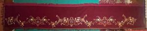 Sacred vestment: embroidered cloth with floral and religious motifs.