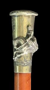 Women's riding crop with silver pommel.