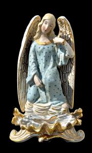 Polychrome porcelain table font depicting an Angel. France.