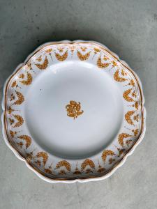 Three plates decorated with festoons and flowers. Moustiers, France. Signed Jean Etienne Baron. Olerys and Laugier manufactory.
