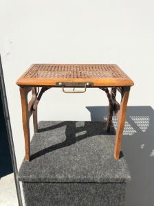 Folding wooden traveling footstool.