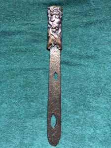 Brass letter opener with fretwork, decorated with frogs and stylized plant motifs. Japan.