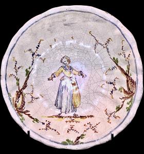 Maiolica cup-basin decorated with a female figure and plant motifs. Levantino manufacture. Albisola.