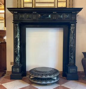 Antique black marble fireplace with columns
