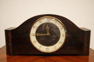 Antique Italian Art Deco style oak clock from the early 1900s.