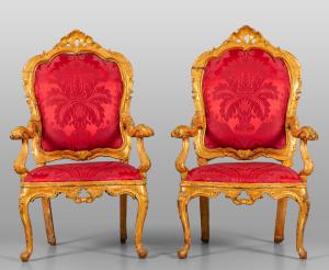 Pair of Louis XV armchairs in carved and gilded wood, upholstered in red damask, Venice, first half of the 18th century