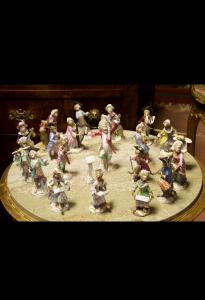 Meissen orchestra, 19th century, complete with 21 figures, plus music stand.