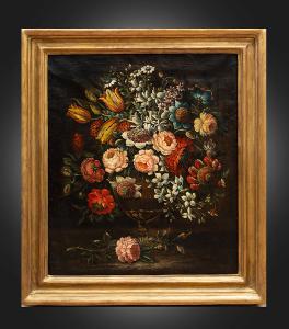 Antique oil on canvas painting with coeval frame depicting a still life with flowers. Naples 17th century.