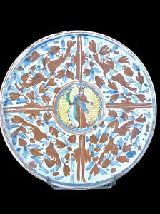 Majolica stand with calligraphic-naturalistic decoration, with the figure of Saint Catherine of Alexandria in the center holding a palm, a sword, and a book. Deruta.