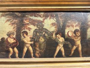 Oil on panel with a dance of cupids, Central Italy, 17th century.