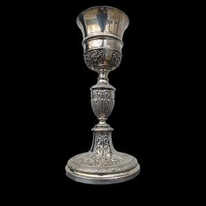 Embossed silver chalice with rocaille and stylized plant decorations. Hallmark of the Kingdom of Sardinia and the city of Genoa.
