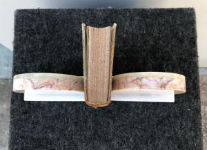 Coppia di fermalibri in marmo stile art-d’eco’.