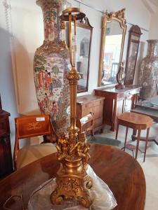 Gilded bronze lamp with a pair of satyrs