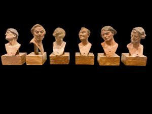 Series of 6 heads of Neapolitan nativity figurines in painted terracotta with glass eyes mounted on a wooden base.