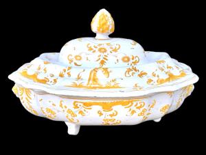 Faience tureen on three feet with ochre monochrome decoration. Moustiers, France.