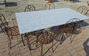 Iron base table with stone top