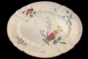 Oval majolica plate decorated with a 'rose' design. Finck Manufacture. Bologna.