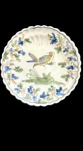 Majolica plate decorated with a bird and vegetal motifs, Coppellotti manufacture, Lodi.