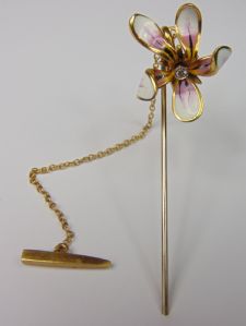 Gold and enamel pin with brilliant-cut diamond, depicting an orchid flower. 1950s