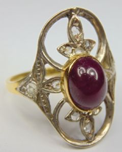 Gold and silver ring with cabochon ruby and small rose-cut diamonds. 1940s