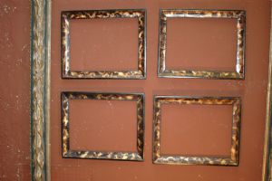 Gruppo di 4 cornici in legno laccato a finta tartaruga ed ebano XIX° sec. luce cm.33 x 43 