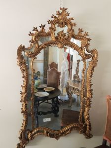 Large gilded wood mirror with ornamental carvings