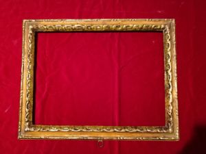 Cornice in legno laccato beige e argentata nella parte intagliata. Integra in patina XVIII° sec. luce cm.56x41