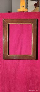 Cornice lastronata in noce con profilo interno in ottone luce cm.31 x 22 est. 38 x 30
