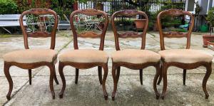 four walnut chairs