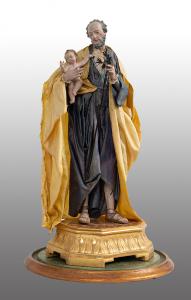 Scultura antica raffigurante San Giuseppe col Bambino sotto campana coeva. Napoli inizio XIX secolo.