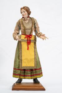 Scultura presepiale napoletana raffigurante "Popolana giovane" avente testa in terracotta con occhi di cristallo e arti in legno policromo.