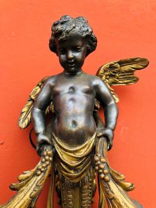 Par de esculturas em bronze patinado e dourado, do século XIX.