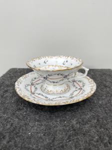 Porcelain mustache cup with floral decoration. France.