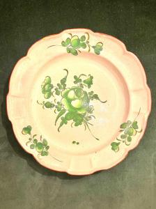 Piatto in maiolica con decoro verde a motivi floreali.Strasburgo .Francia