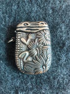 Brass matchbox with Aztec-style crocodile decoration. Italy.
