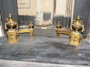 Pair of Louis XVI brass fire dogs, gold finish, 30 x 30 cm.