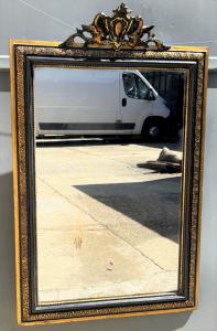 Mirror with crest